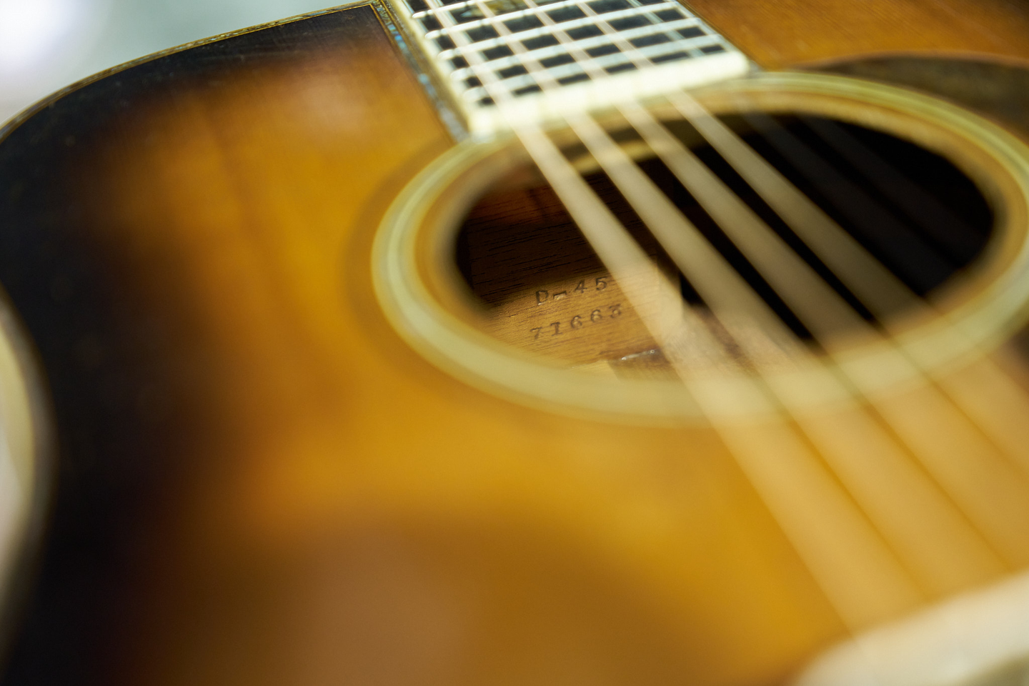 View of the serial number and model of the guitar inside the body